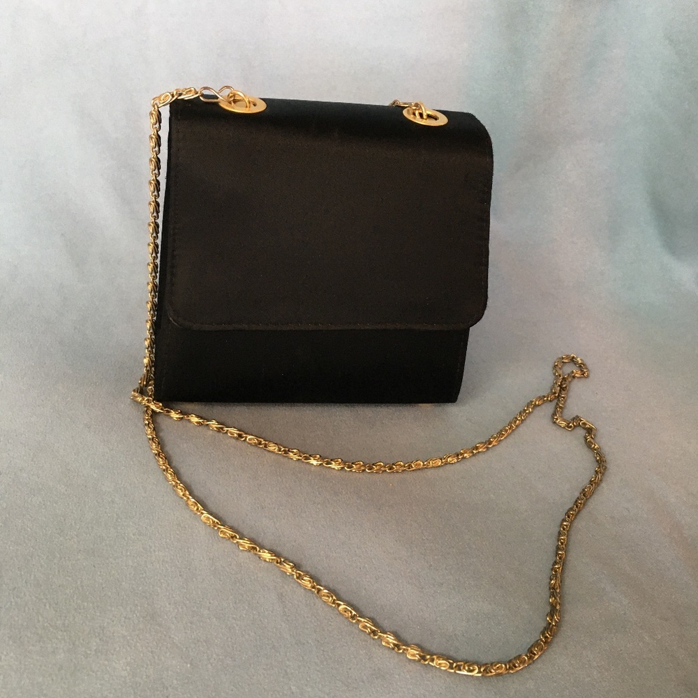 Small black clutch bag.